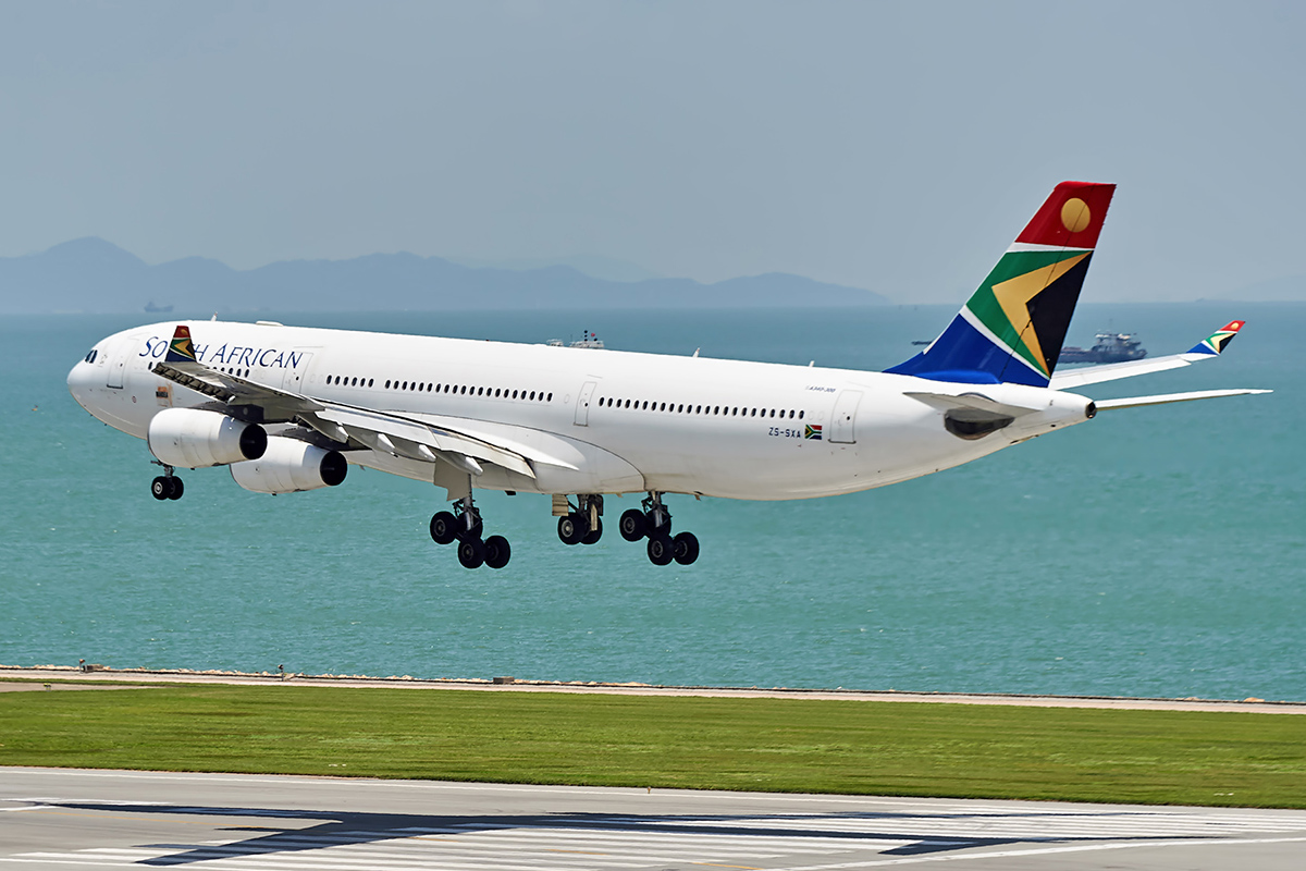 HONG KONG - JUNE 04, 2015: South African Airways aircraft landing at Hong Kong airport. South African Airways (SAA) is the national flag carrier and largest airline of South Africa
